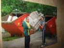 Max and Paddy taking a sofa out of a skip